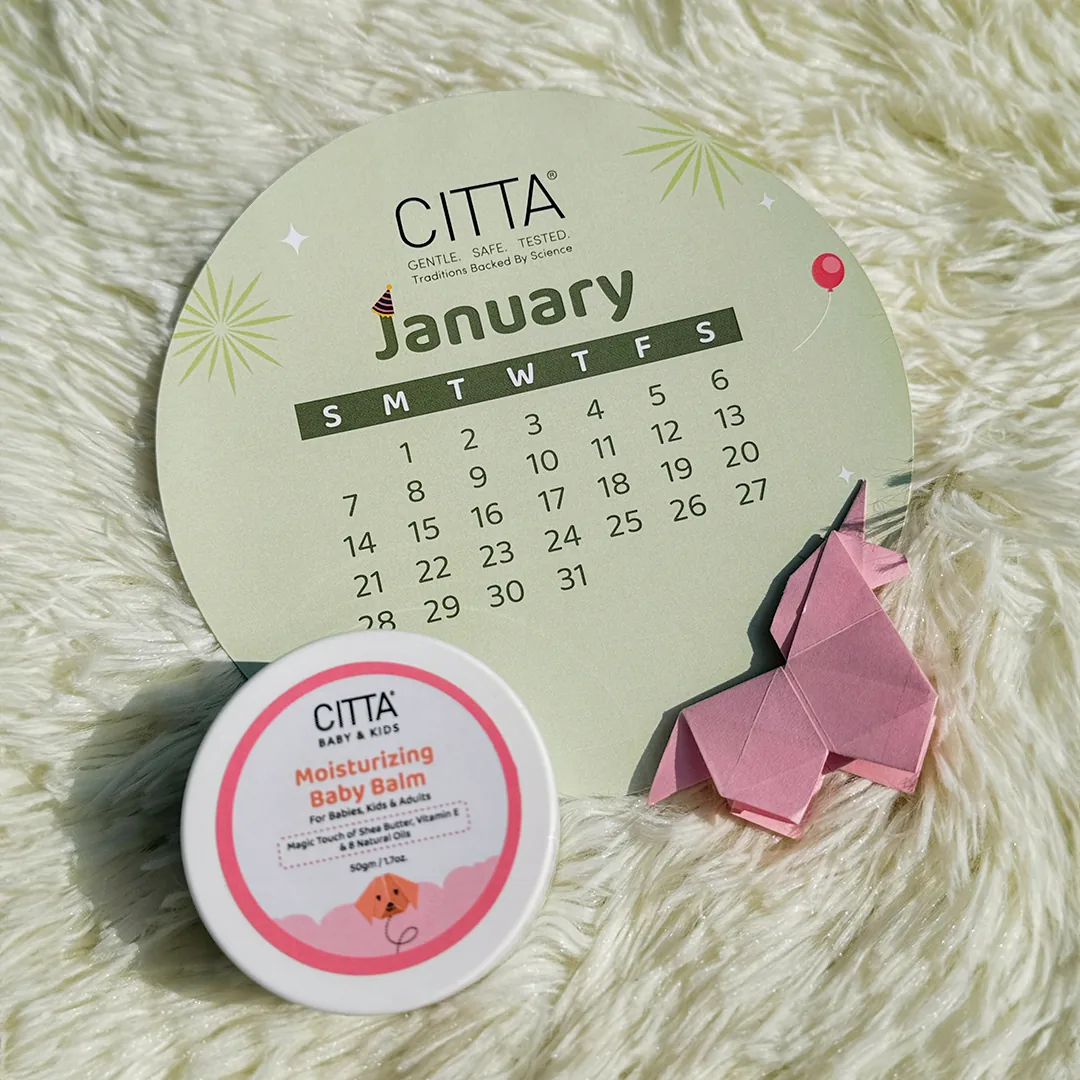 CITTA calendar print design photographed with baby balm